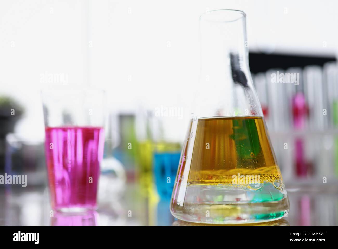 Glass flasks filled with different colours liquids for further investigation Stock Photo