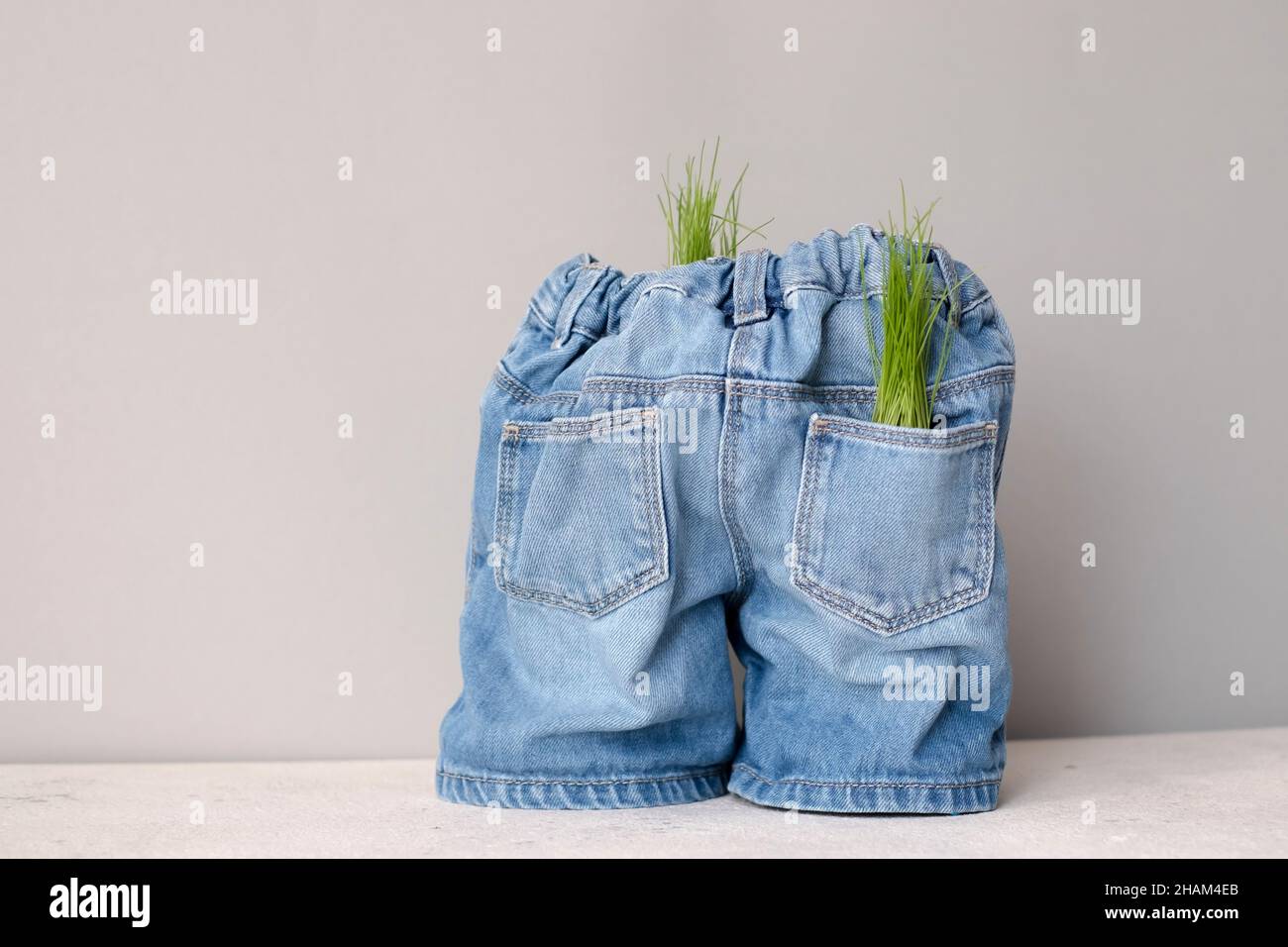 Creative concept of clothing recycling. Ecological and sustainable denim. Zero and fabric waste. Stock Photo