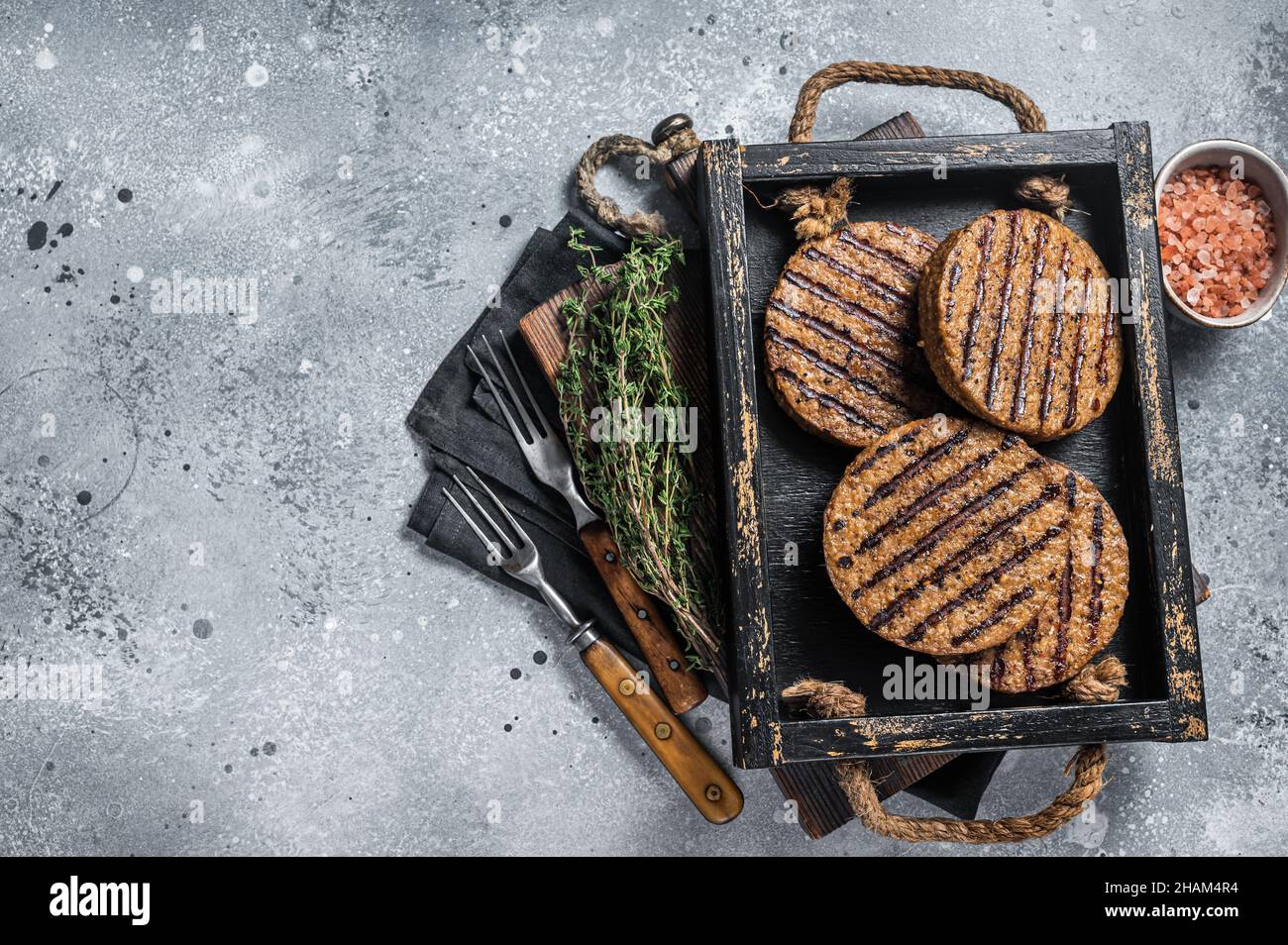 Roasted meat free patties, plant based meat burger cutlets in wooden