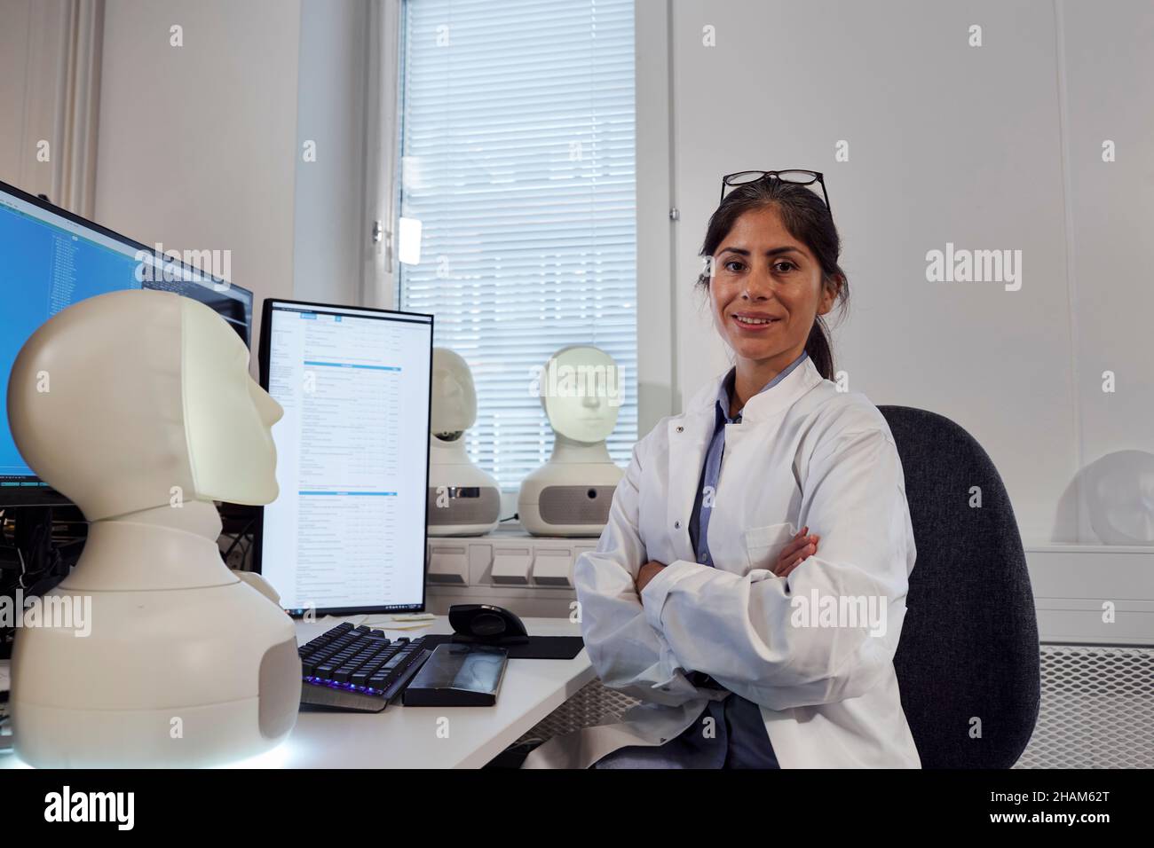 Portrait of female engineer at work station Stock Photo