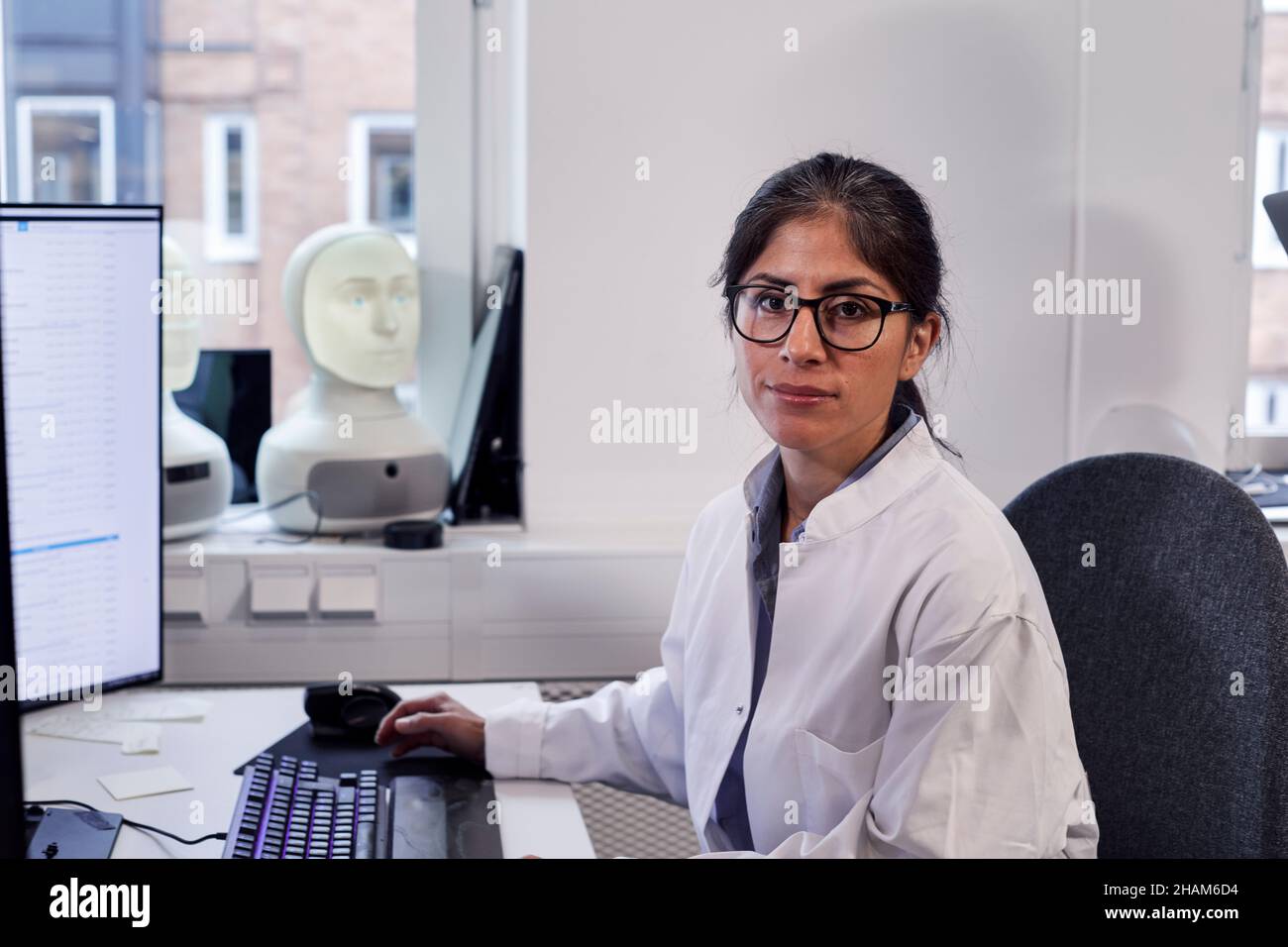 Portrait of female engineer at work station Stock Photo