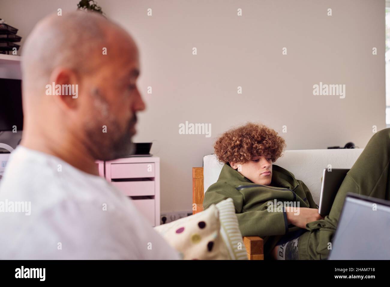 Father and son using laptops Stock Photo