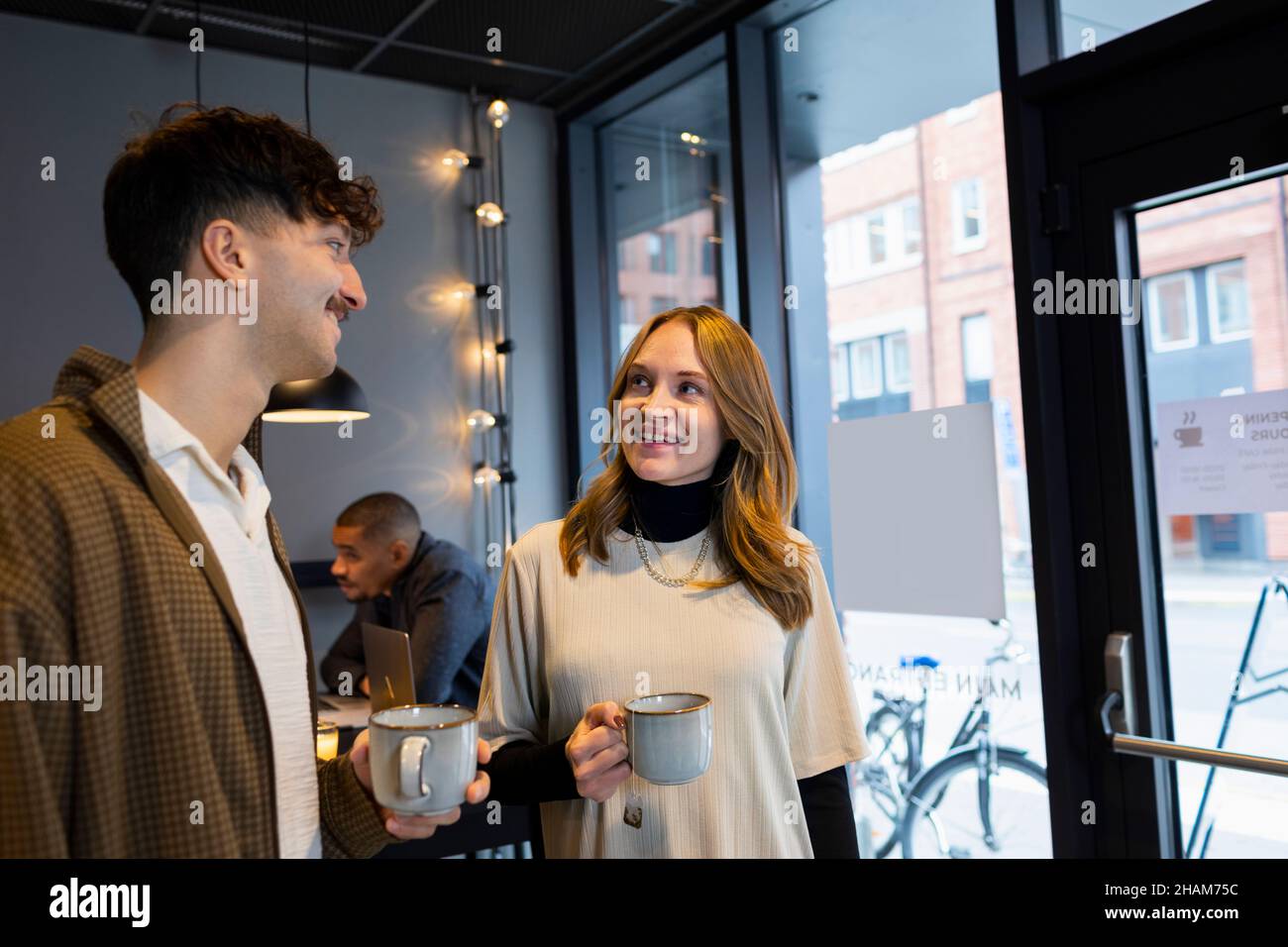Coworkers having coffee break in office Stock Photo