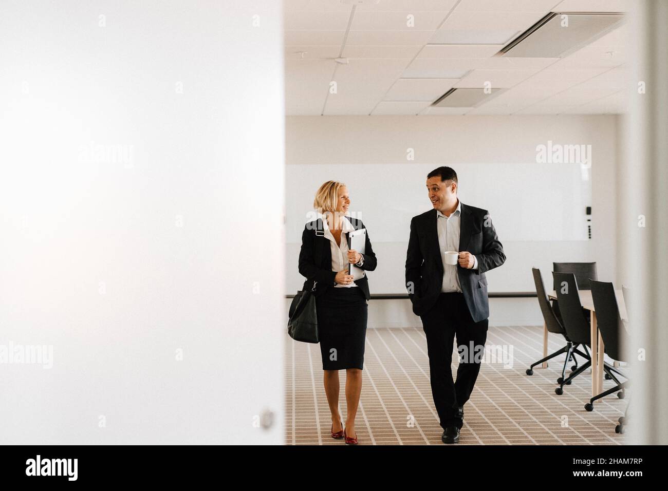 Businesspeople talking in office Stock Photo