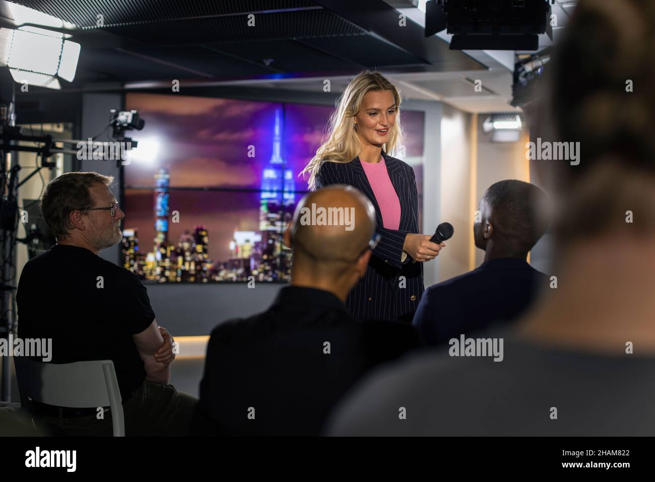 TV show host interviewing audience member Stock Photo