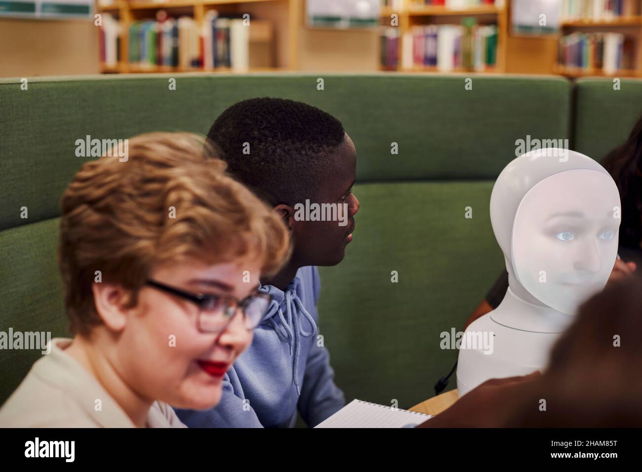 Young man sitting in library Stock Photo