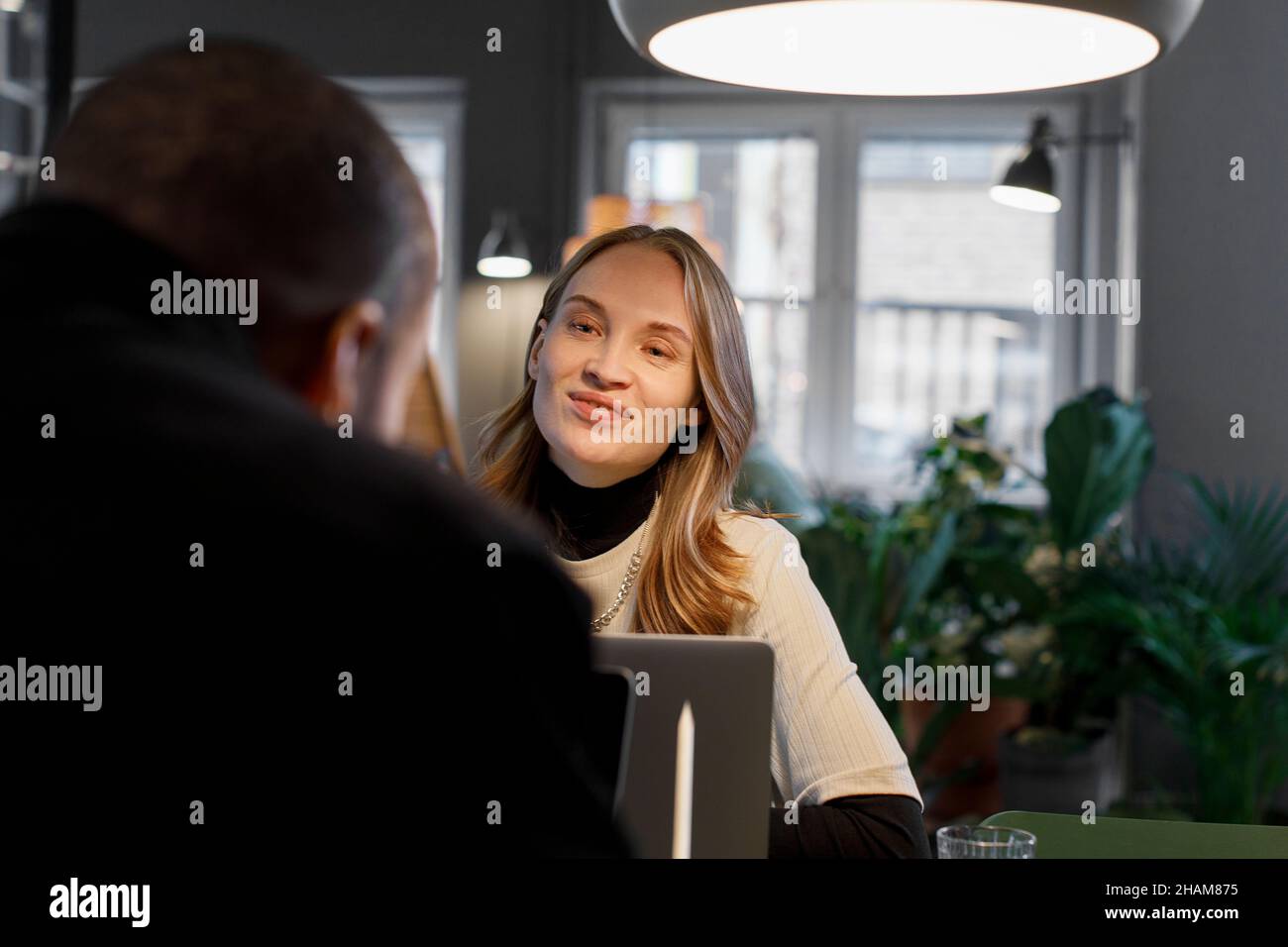 Woman talking in the office Stock Photo