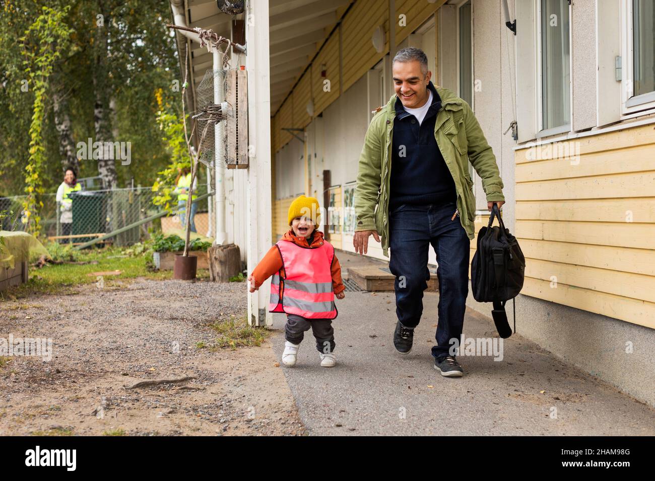 Father collecting child from school Stock Photo - Alamy