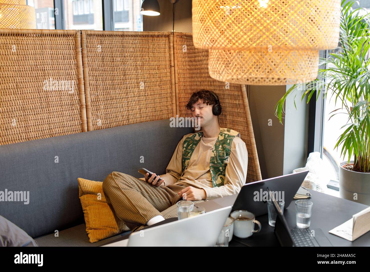 Young man relaxing in cafe Stock Photo