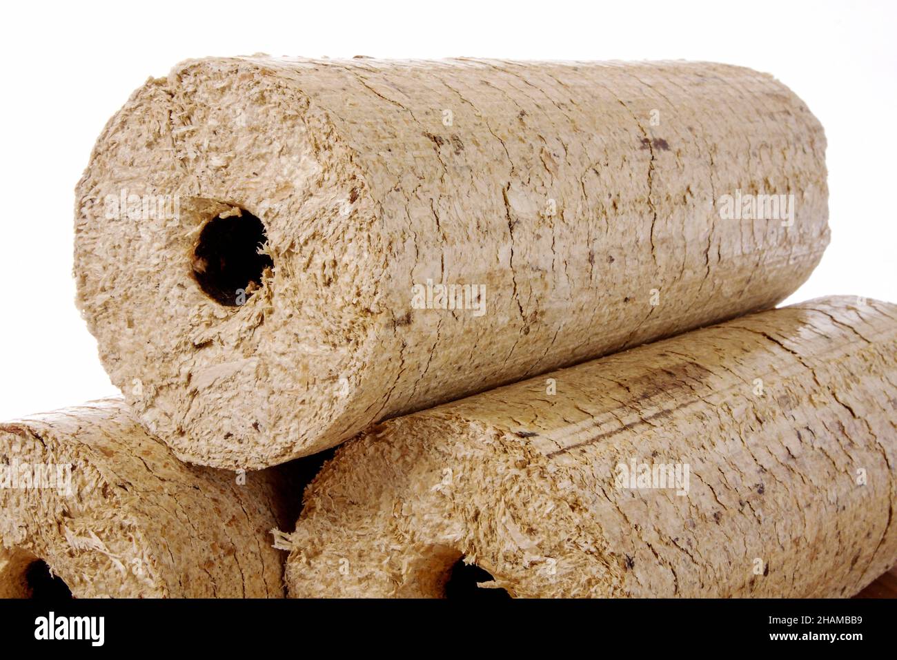 round wooden briquettes isolated against a white background Stock Photo