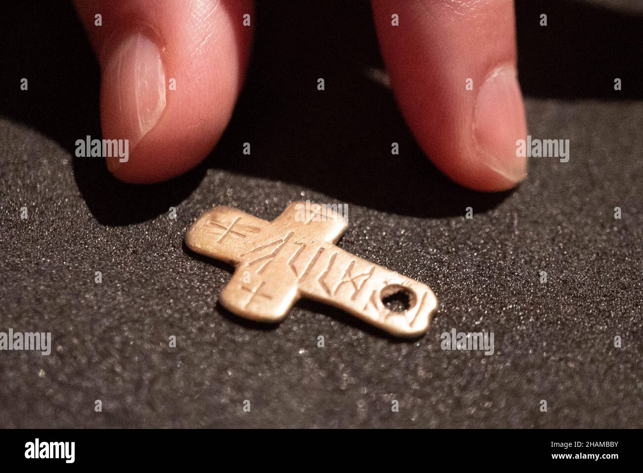 London, UK. 14th December, 2021. A unique gold cross with a runic inscription, one of various archaeological discoveries made by members of the public to be displayed at the British Museum. These finds are recorded under the British Museum’s Portable Antiquities Scheme (PAS) and Treasure annual reports. Photo: Richard Gray/Alamy Live News Stock Photo