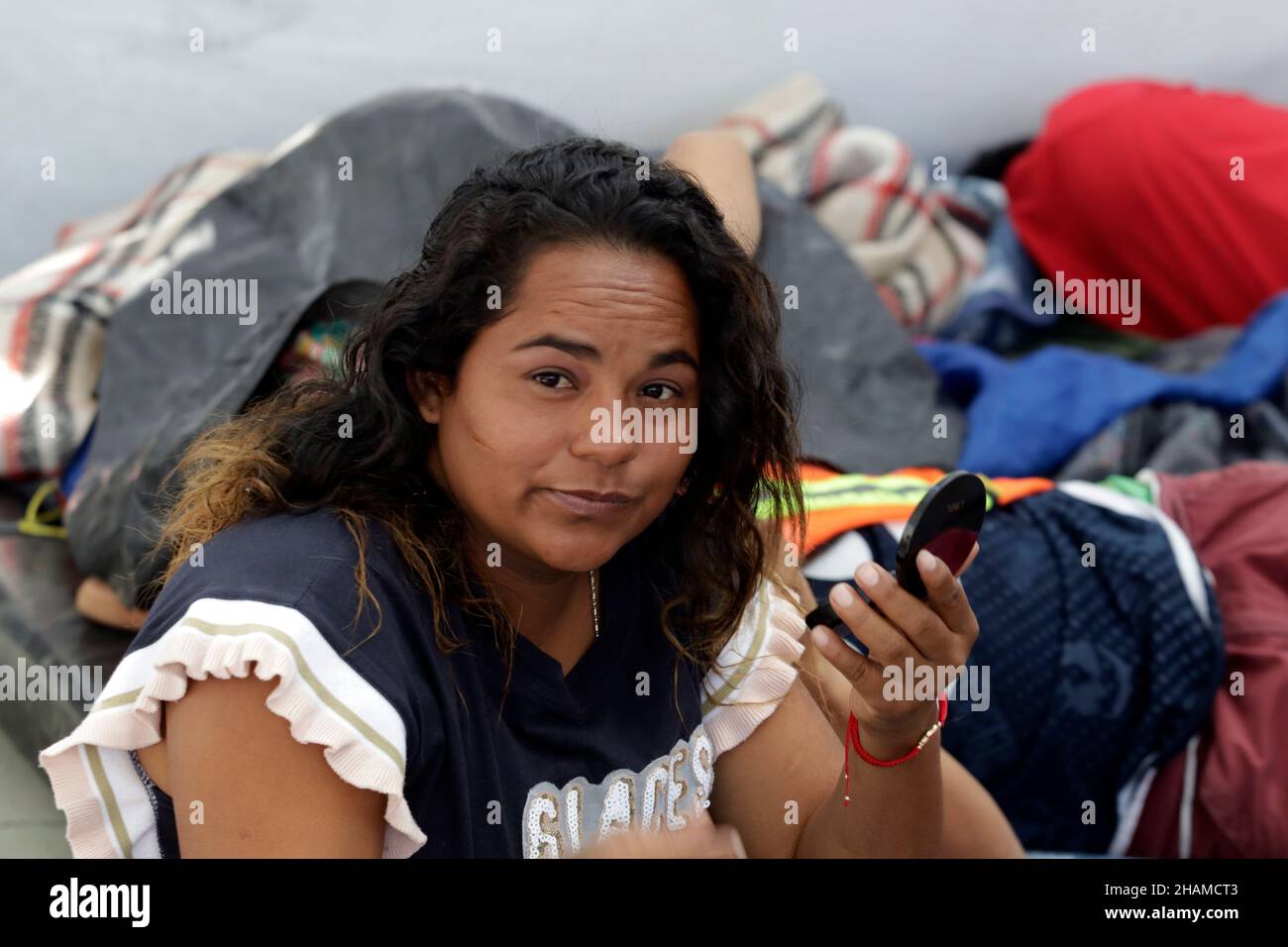 Non Exclusive: MEXICO CITY, MEXICO - DECEMBER 13, 2021: Migrants rest during their stay at Casa del Peregrino San Juan Diego before continue their jou Stock Photo