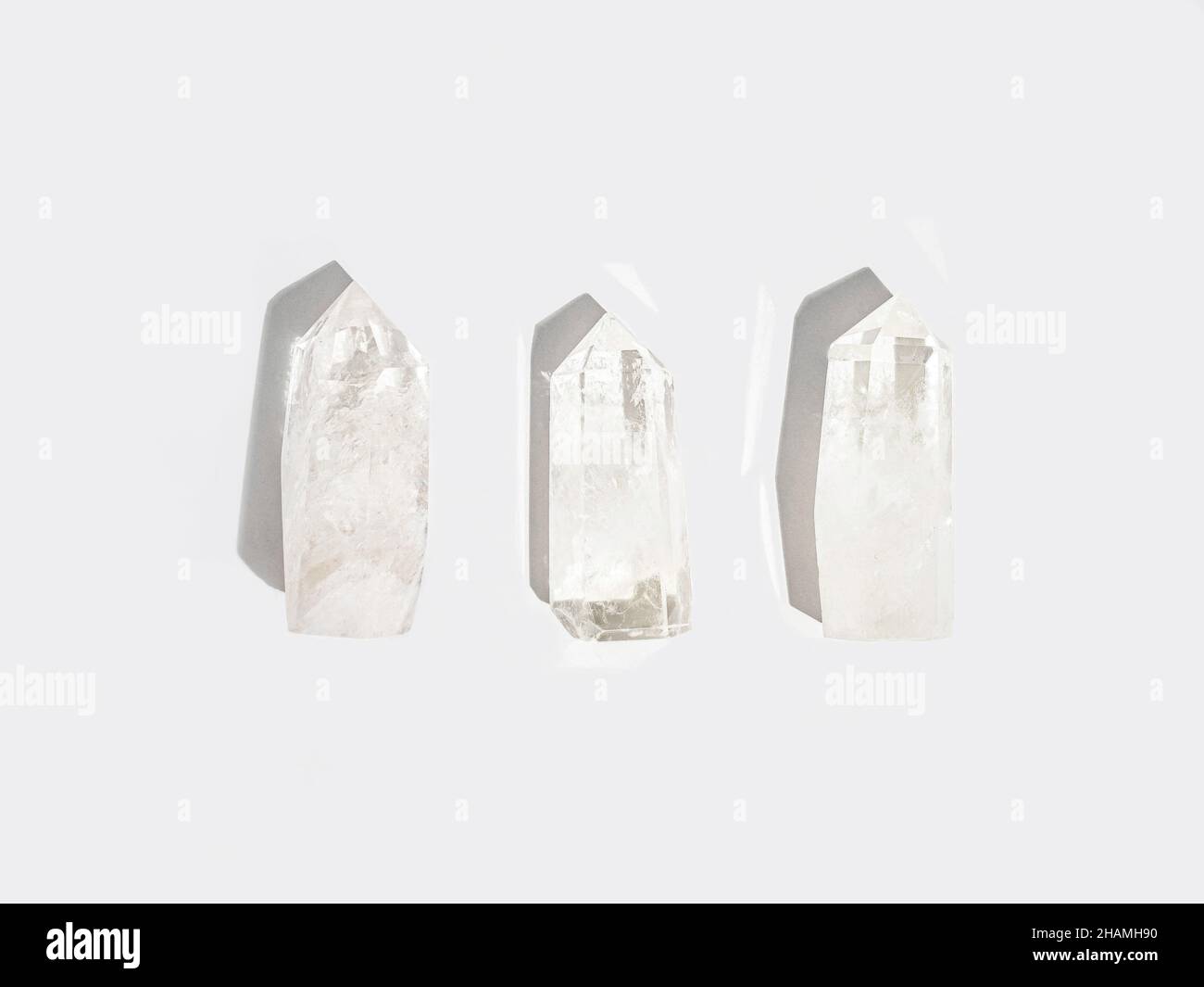 Collection natural crystals quartz on white background. Top view. Copy