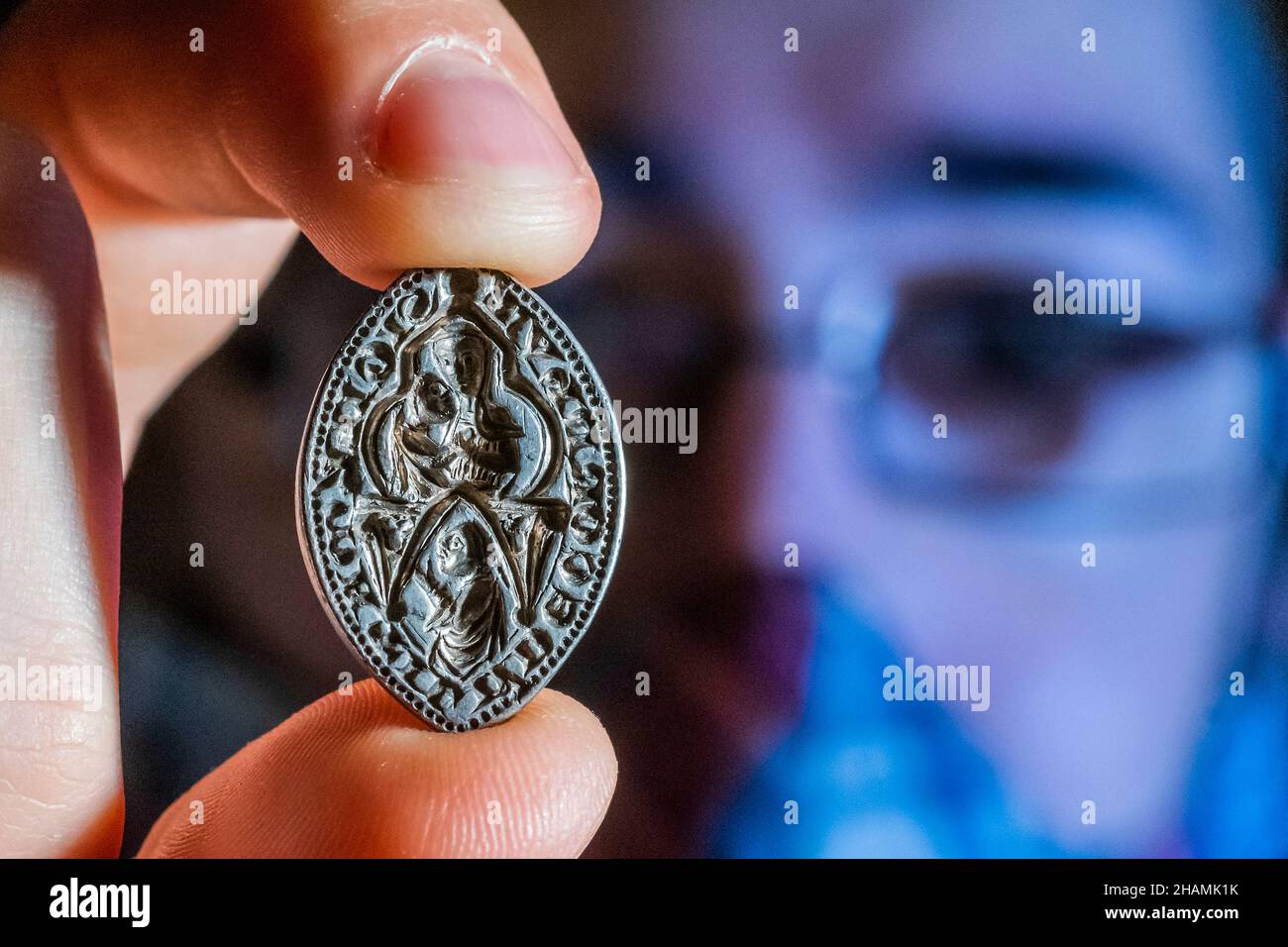 London, UK. 14th Dec, 2021. A silver medieval seal matrix that uncommonly depicts a high-status woman, AD 1200-1300 found in Kent - A first look at recent archaeological discoveries made by members of the public, which are being announced for the first time at the British Museum. These finds are recorded under the British Museum's Portable Antiquities Scheme (PAS) and Treasure annual reports. Credit: Guy Bell/Alamy Live News Stock Photo