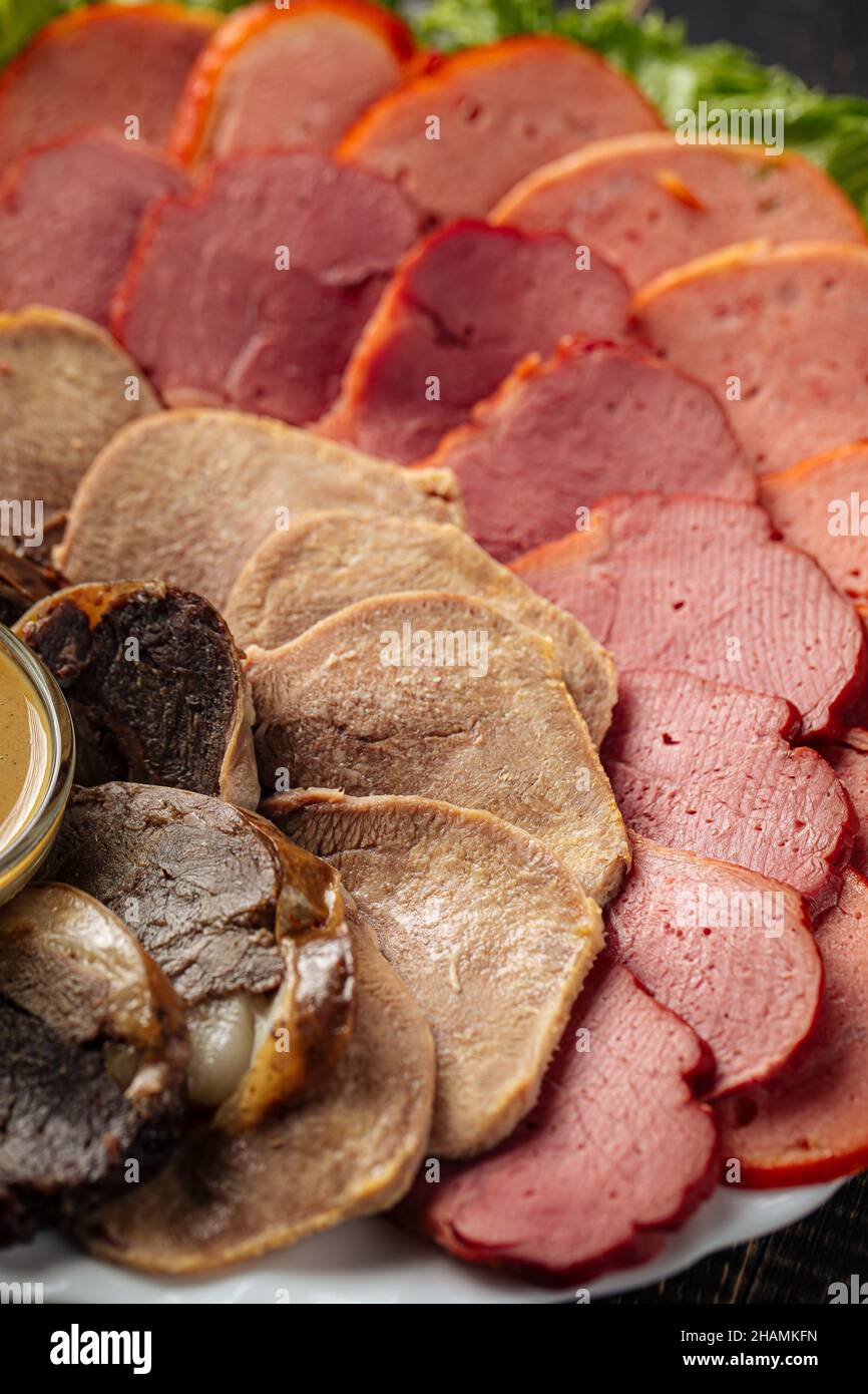 Assorted sliced smoked meat platter appetizer Stock Photo Alamy