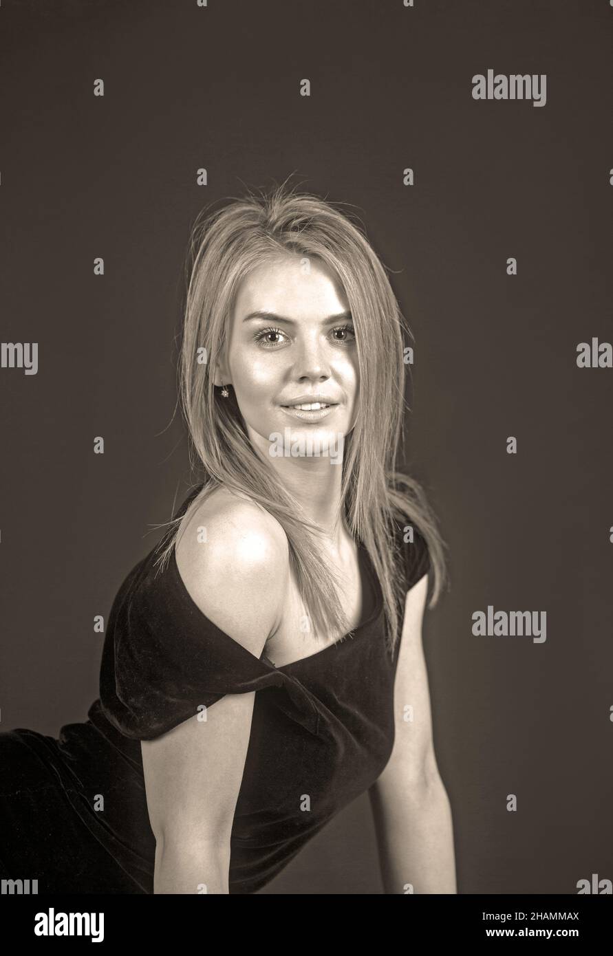 Portrait of beautiful blonde woman in black dress. Fashion photo Stock ...