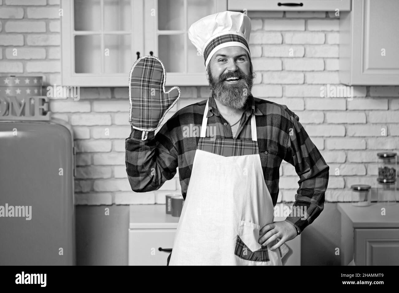 Famous chef of a home restaurant prepares dishes. Stock Photo