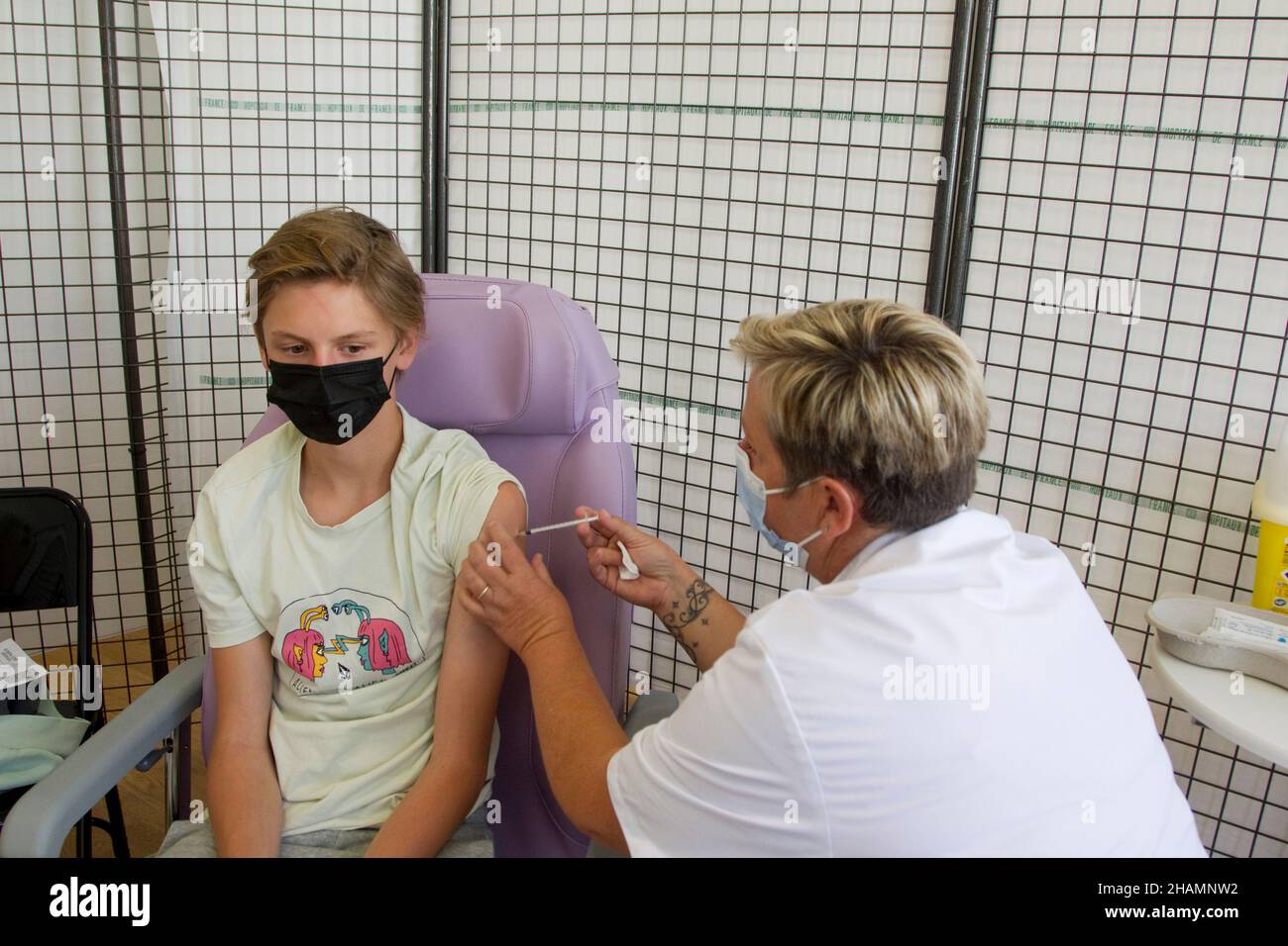 Briancon (French Alps, south-eastern France): COVID-19 vaccination center. Young boy, teenager, getting vaccinated on August 10, 2021 Stock Photo