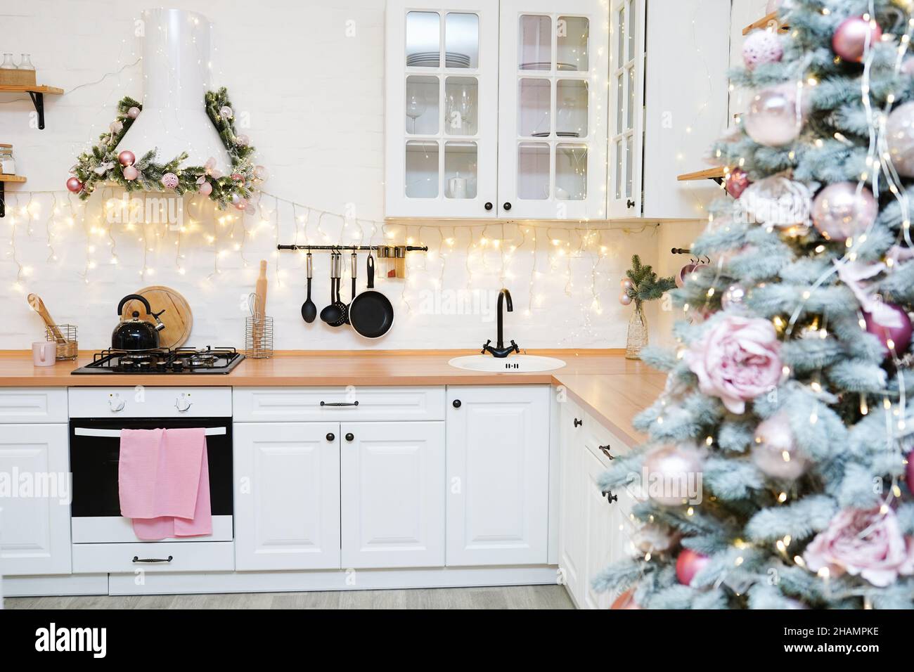 Interior light kitchen with pink christmas decor and lights Stock Photo ...