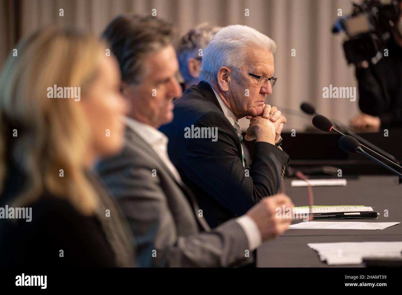 Stuttgart, Germany. 14th Dec, 2021. Winfried Kretschmann (Bündnis 90/Die Grünen, r-l), Minister President of Baden-Württemberg, Manfred Lucha (Bündnis 90/Die Grünen), Minister of Social Affairs of Baden-Württemberg, and Thekla Walker (Bündnis 90/Die Grünen), Minister of the Environment, Climate and Energy Economy in Baden-Württemberg, attend the government press conference in the Citizens' and Media Centre of the State Parliament of Baden-Württemberg. Credit: Marijan Murat/dpa/Alamy Live News Stock Photo