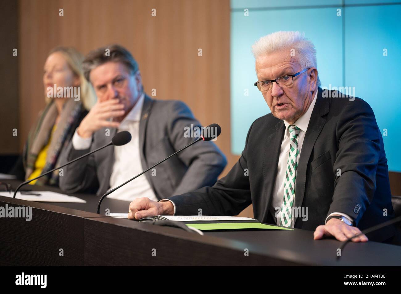 Stuttgart, Germany. 14th Dec, 2021. Winfried Kretschmann (Bündnis 90/Die Grünen, r-l), Minister President of Baden-Württemberg, Manfred Lucha (Bündnis 90/Die Grünen), Minister of Social Affairs of Baden-Württemberg, and Thekla Walker (Bündnis 90/Die Grünen), Minister of the Environment, Climate and Energy Economy in Baden-Württemberg, attend the government press conference in the Citizens' and Media Centre of the State Parliament of Baden-Württemberg. Credit: Marijan Murat/dpa/Alamy Live News Stock Photo