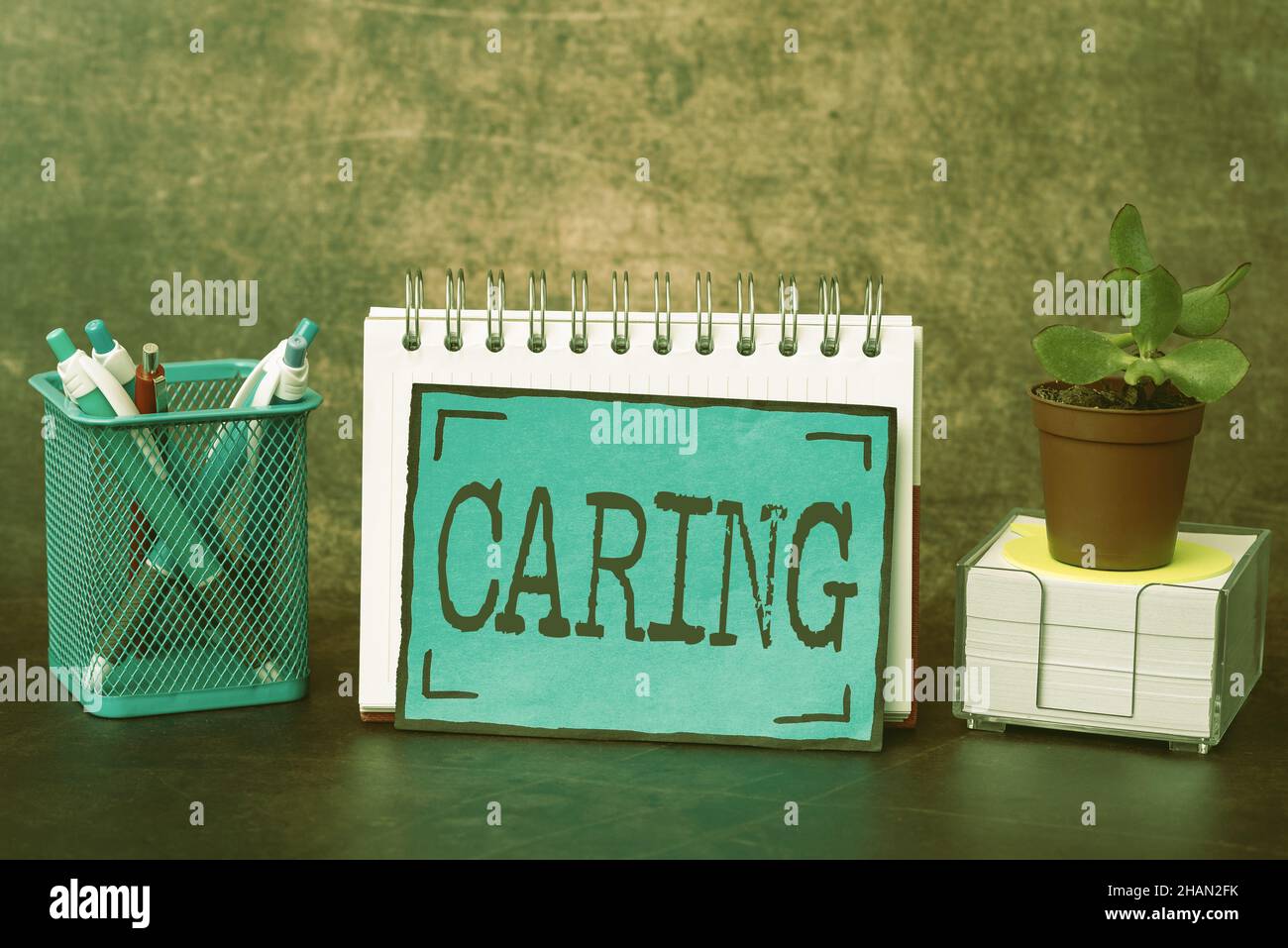 Writing displaying text Caring. Concept meaning practice of looking ...
