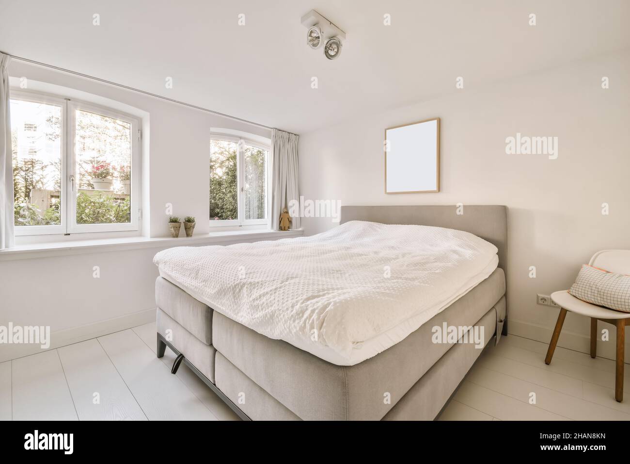 Interior of a cozy and bright bedroom with beautiful decoration Stock ...