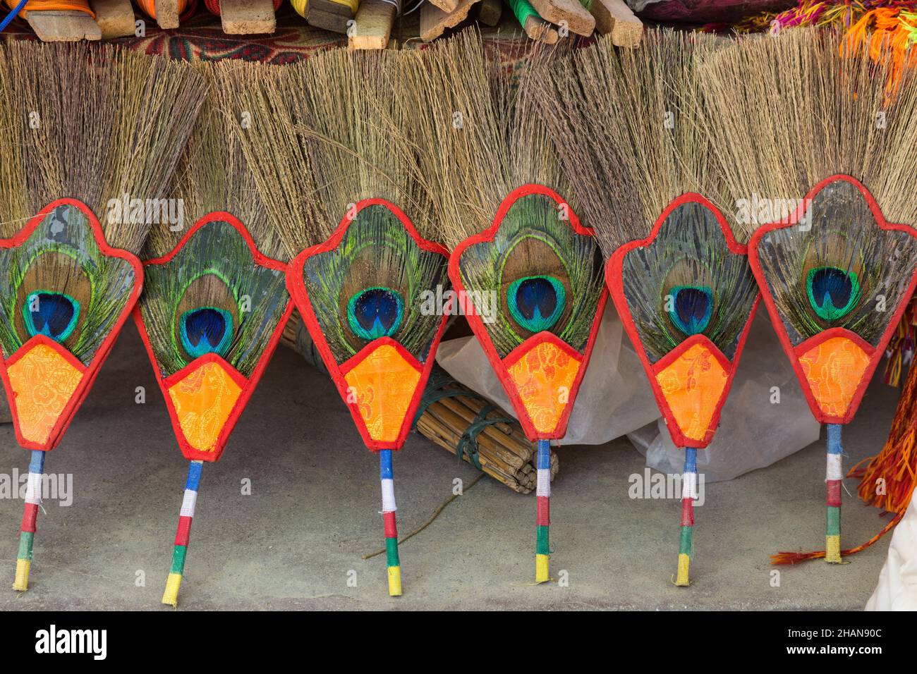 Bhumpa peacock feather fans for sale on the street by the Boudanath Stupa in Kathmandu, Nepal.  Used in Buddhist tantric rituals, usually after lighti Stock Photo