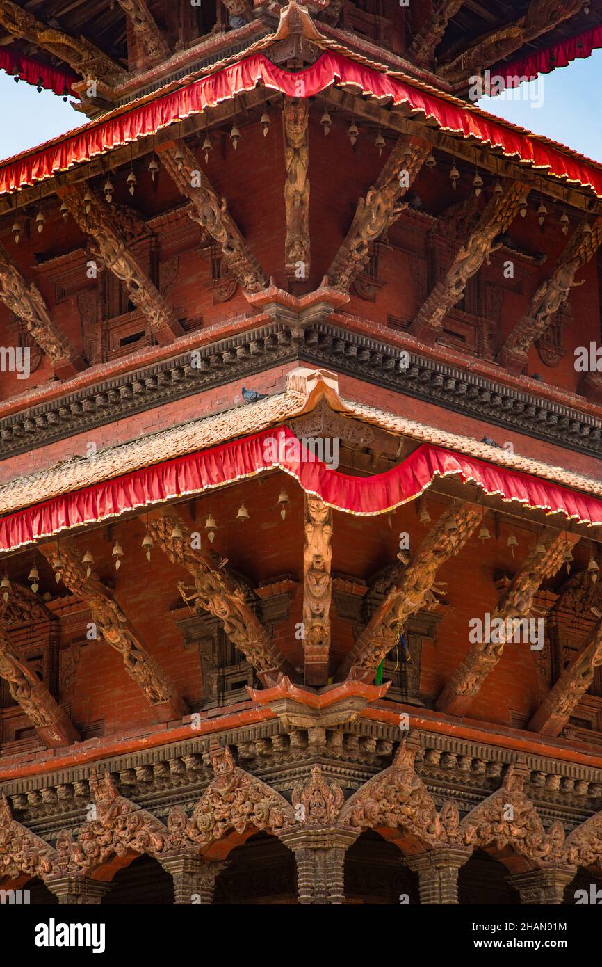 Carved wooden deities and animals on the roof trusses of the Harishankar Temple, a Hindu teimple in Durbar Square, Patan, Nepal. Stock Photo