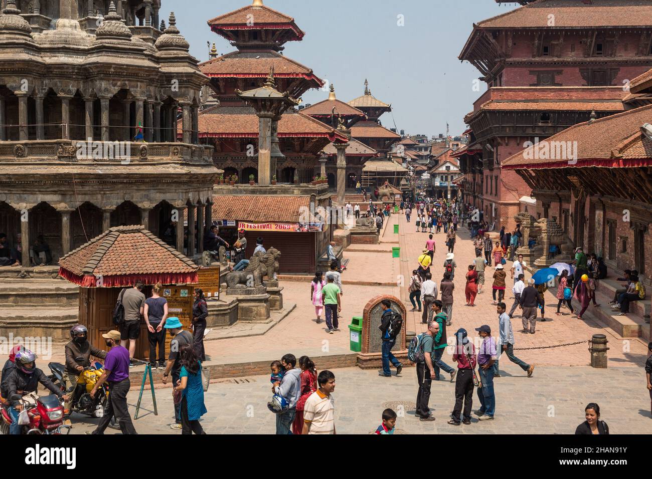 Durbar Square in Patan with a row of temples at left and the royal palace at right.  Nepal. Stock Photo