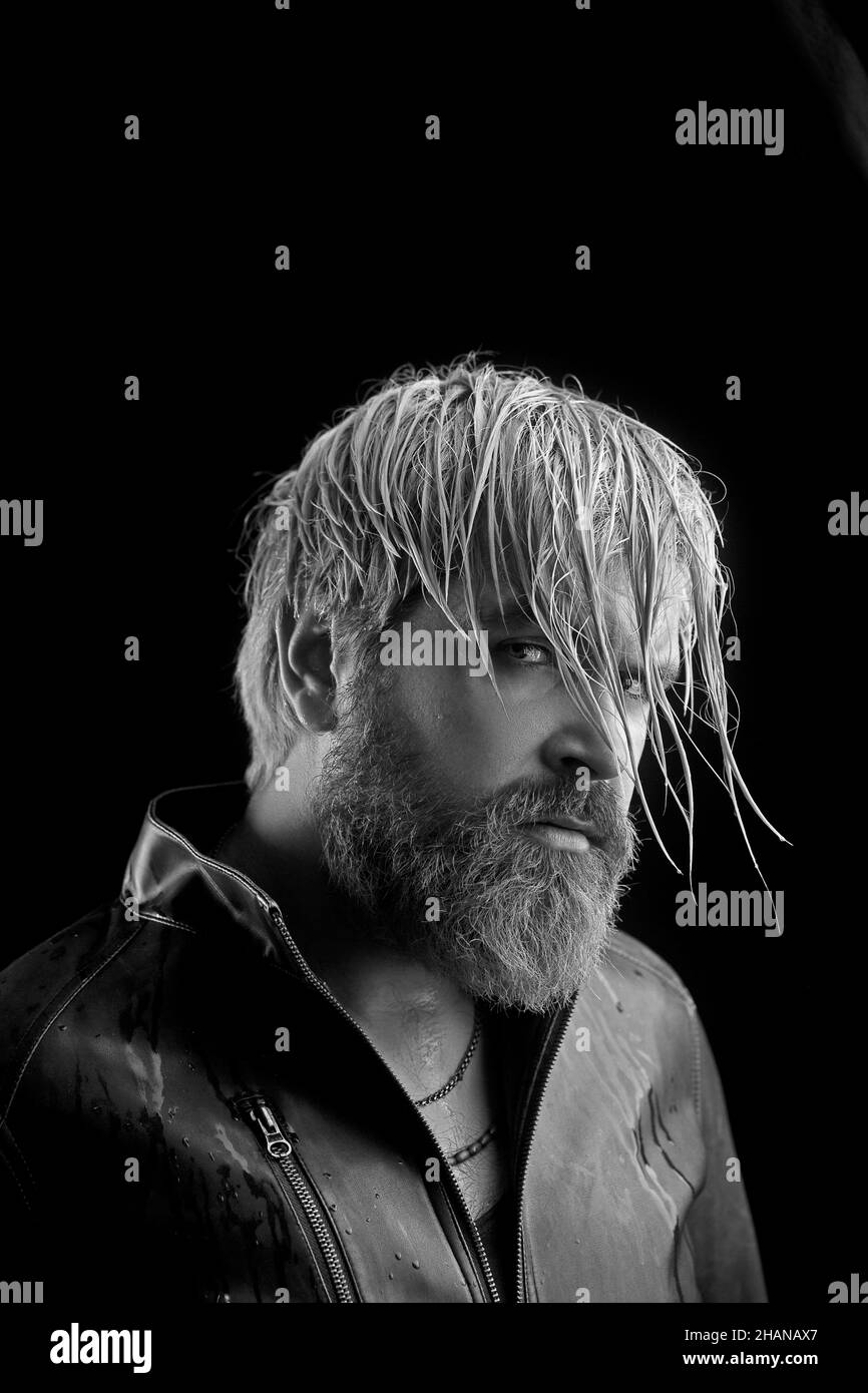 Hipster with long beard and blonde hair. Wet beard and mustache. Stock Photo