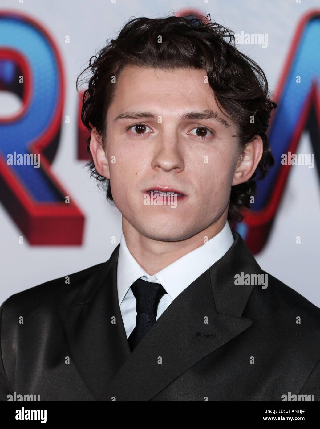 Westwood, United States. 13th Dec, 2021. WESTWOOD, LOS ANGELES, CALIFORNIA, USA - DECEMBER 13: Actor Tom Holland wearing a Prada suit and Christian Louboutin shoes arrives at the Los Angeles Premiere Of Columbia Pictures' 'Spider-Man: No Way Home' held at the Regency Village Theatre on December 13, 2021 in Westwood, Los Angeles, California, United States. (Photo by Xavier Collin/Image Press Agency/Sipa USA) Credit: Sipa USA/Alamy Live News Stock Photo