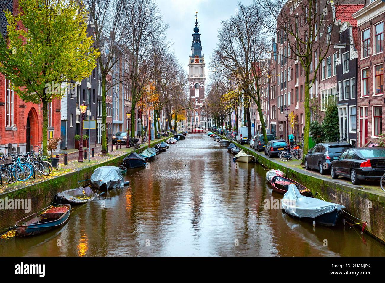 Rainy Amsterdam canal Groenburgwal with Zuiderkerk, southern church, Holland, Netherlands. Stock Photo