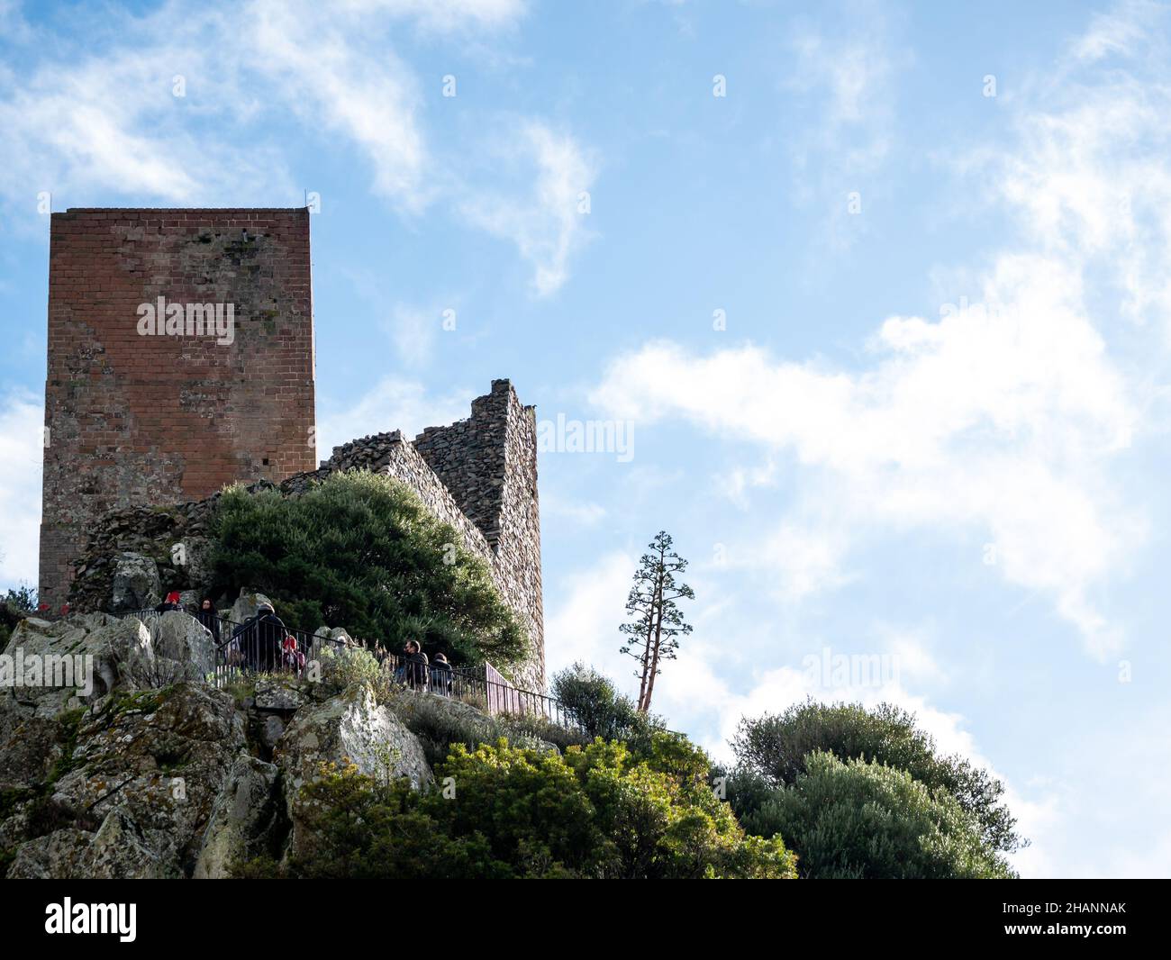 Ancient medieval castle of the small town Burgos in Sardinia - Italy on a hill with blue sky and clouds Stock Photo