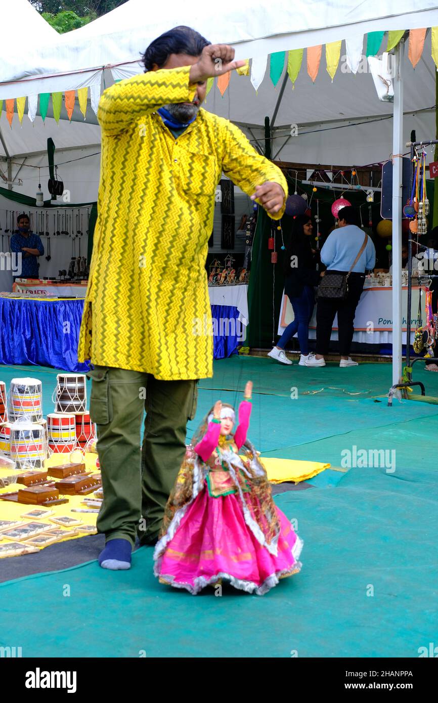 December 11, 2021: Artist performing the art of dancing a puppet at the Local Fair. Stock Photo