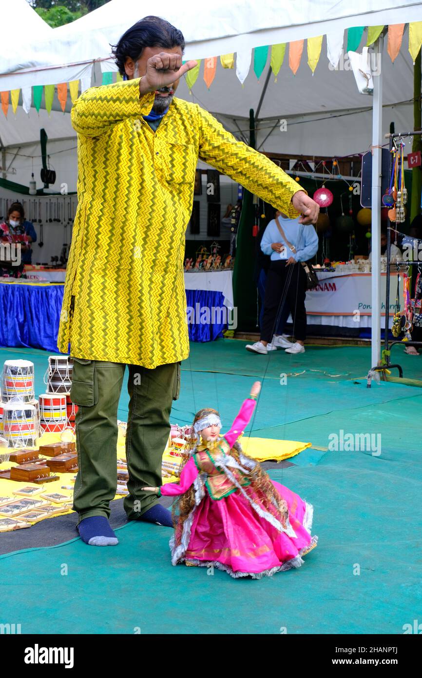 December 11, 2021: Artist performing the art of dancing a puppet at the Local Fair. Stock Photo