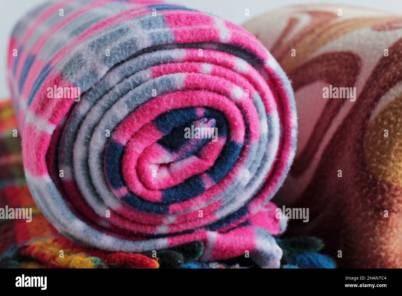 Rolledup,woolen polar,fleece,colored blankets.Close up taken Stock