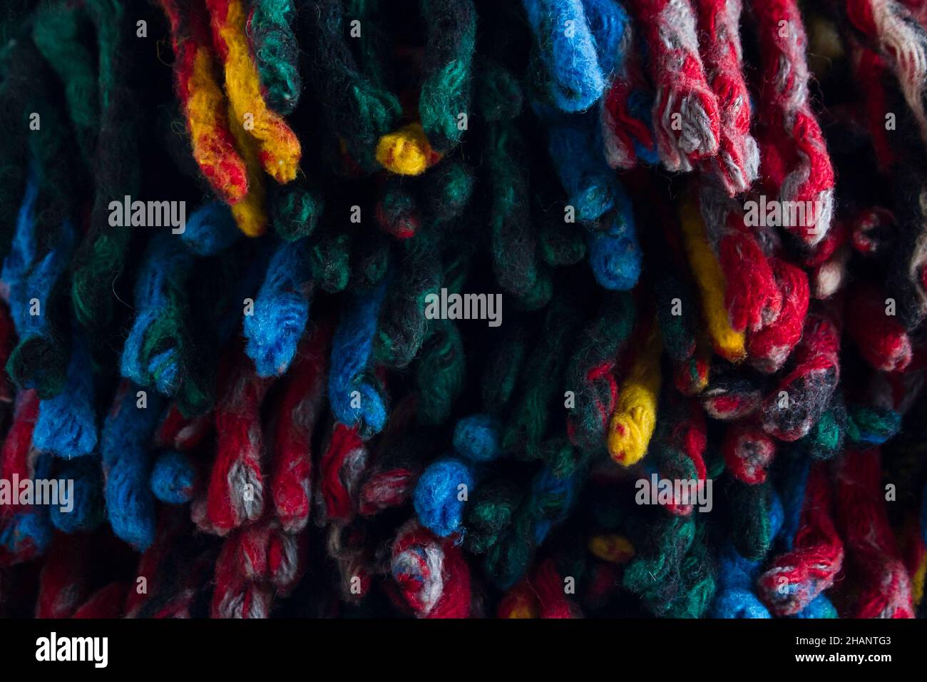 Colorful tassels of scotch, wool blanket background.Close up taken