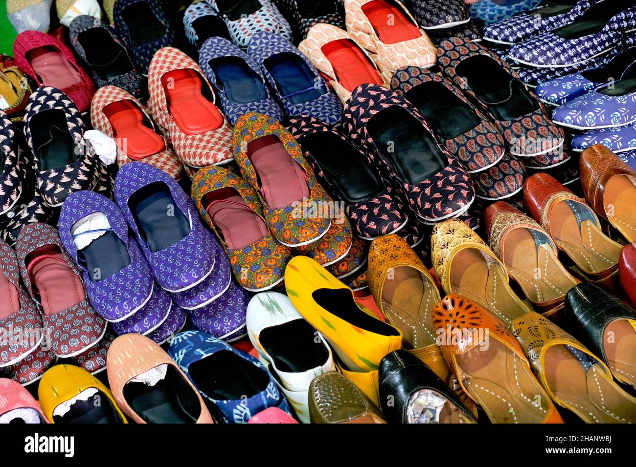 Colorful Handmade chappals (sandals) being sold in an Indian market, Handmade leather slippers, Traditional footwear. Stock Photo