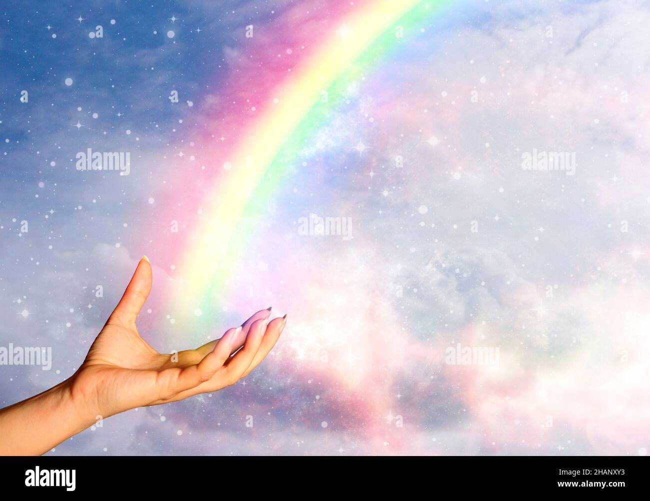 open woman hand and rainbow Stock Photo