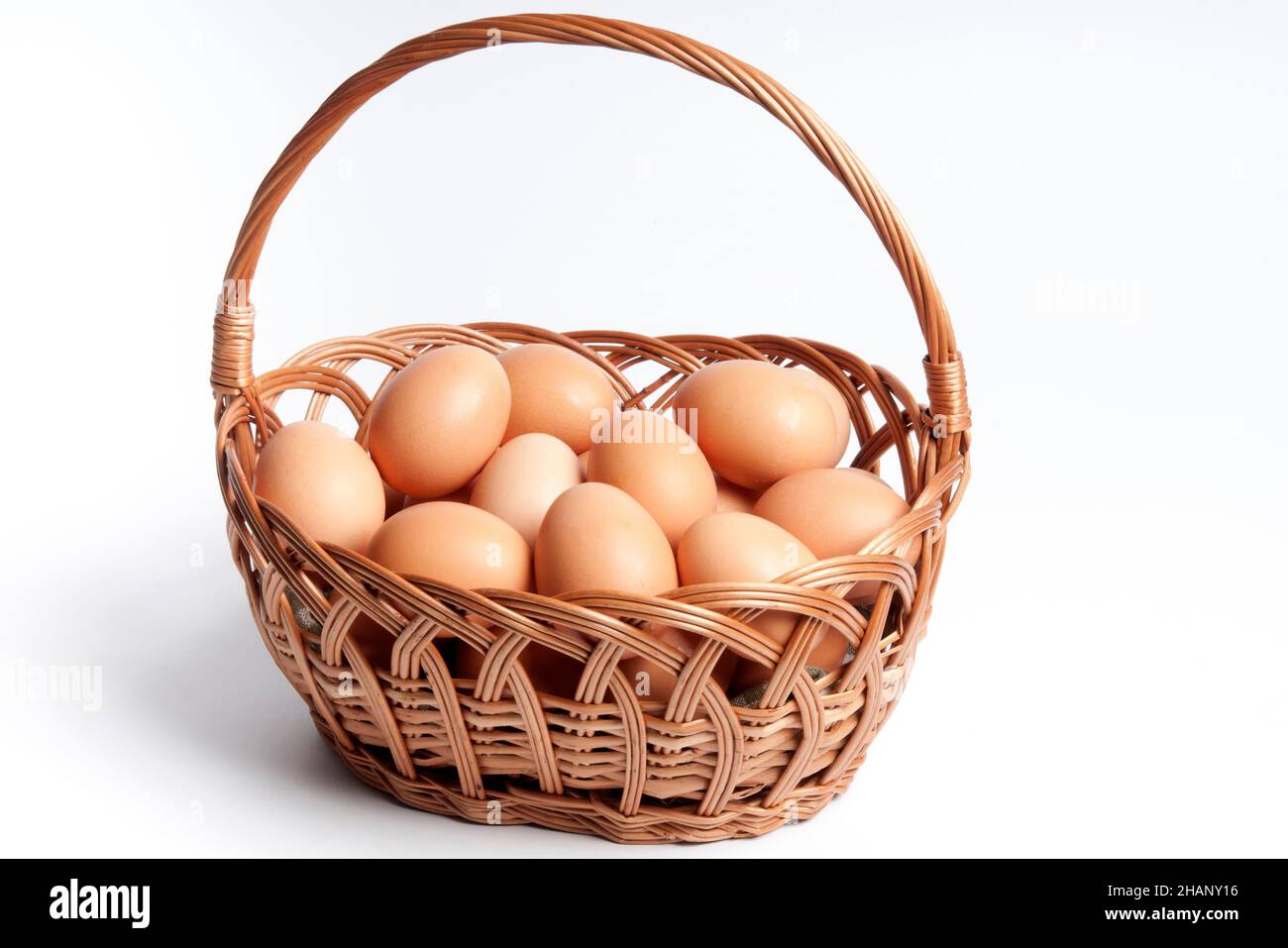 raw eggs in a basket isolated Stock Photo
