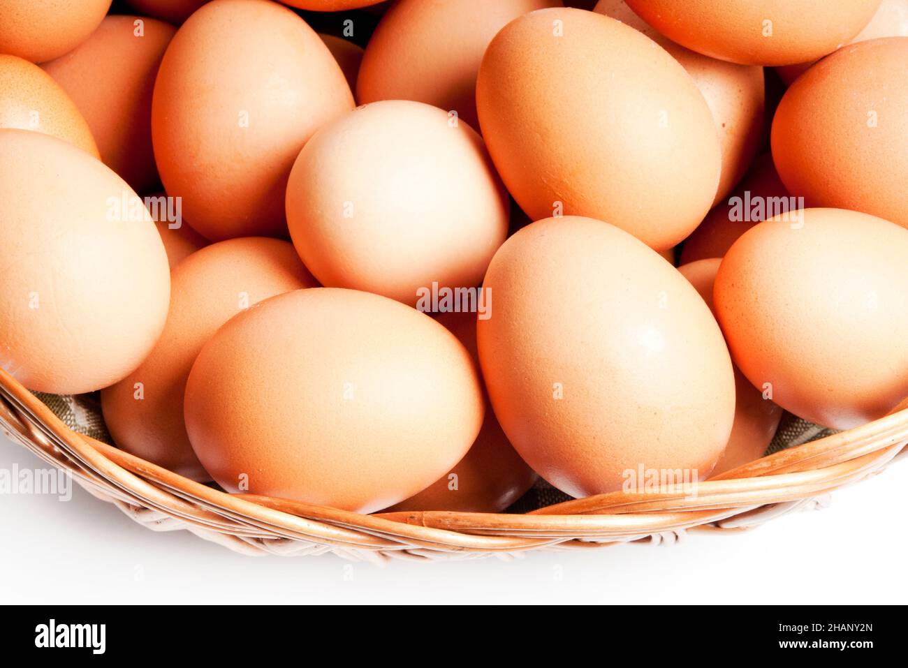 raw eggs in a basket isolated Stock Photo
