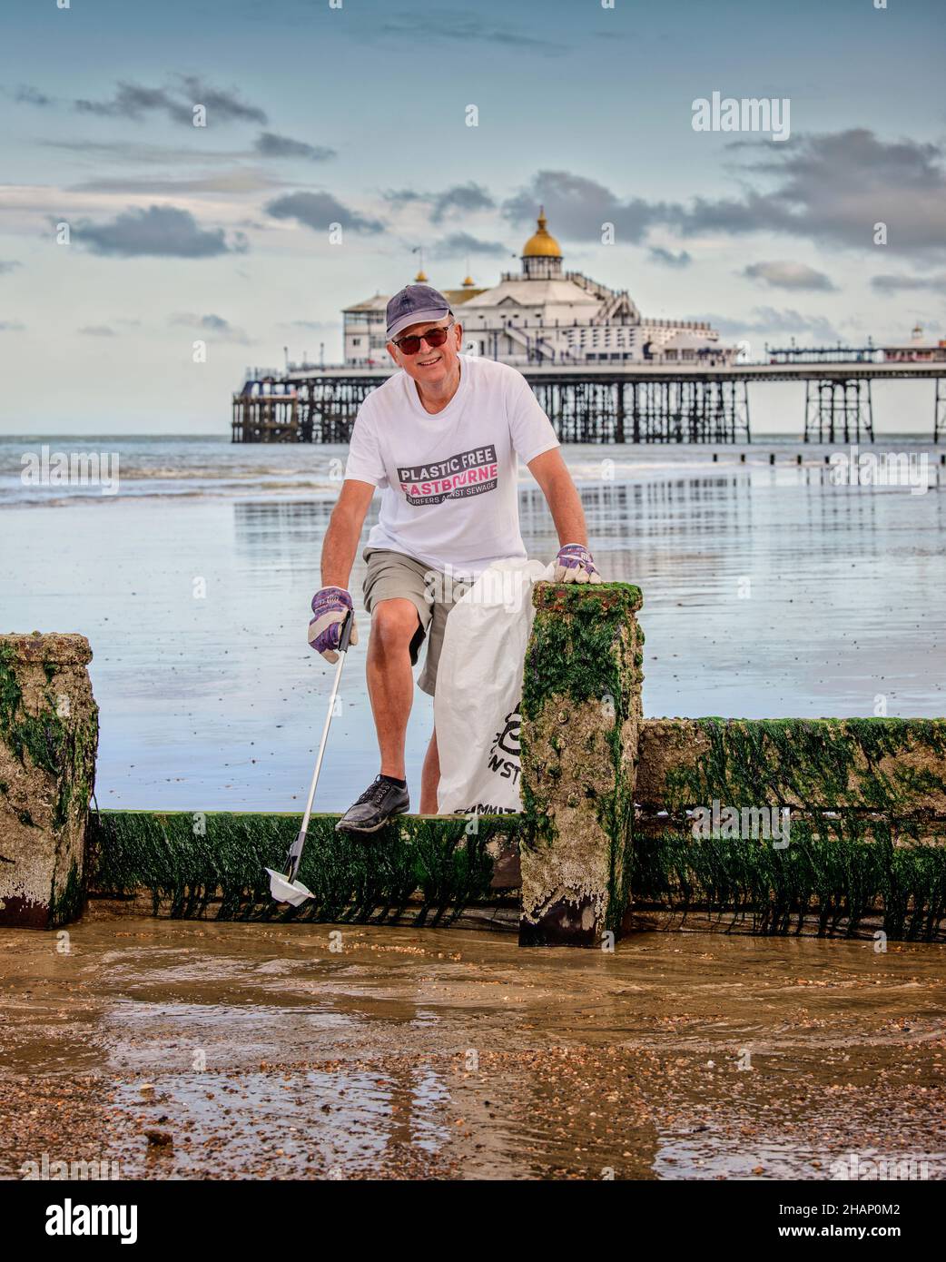Plastic Free Eastbourne campaigner Oliver Sterno on Eastbourne beach, East Sussex, UK. Editorial Use Only Stock Photo