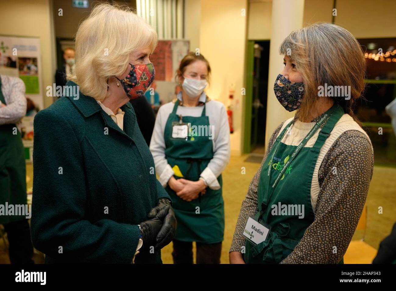 The Duchess of Cornwall speaks to volunteers during a visit to Wandsworth Foodbank at St. Mark's Church in Battersea Rise, London. Picture date: Tuesday December 14, 2021. Stock Photo
