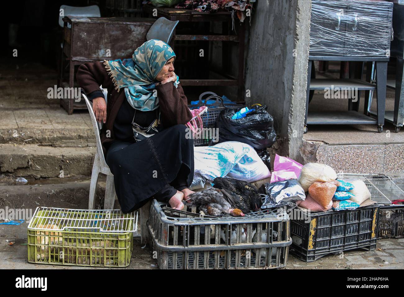 Palestinians shop in the market in Rafah, in southern Gaza Strip, on December 14, 2021. Stock Photo