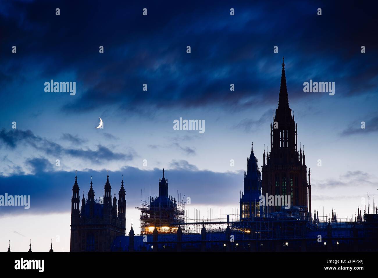 Young Moon over uk parliament Stock Photo