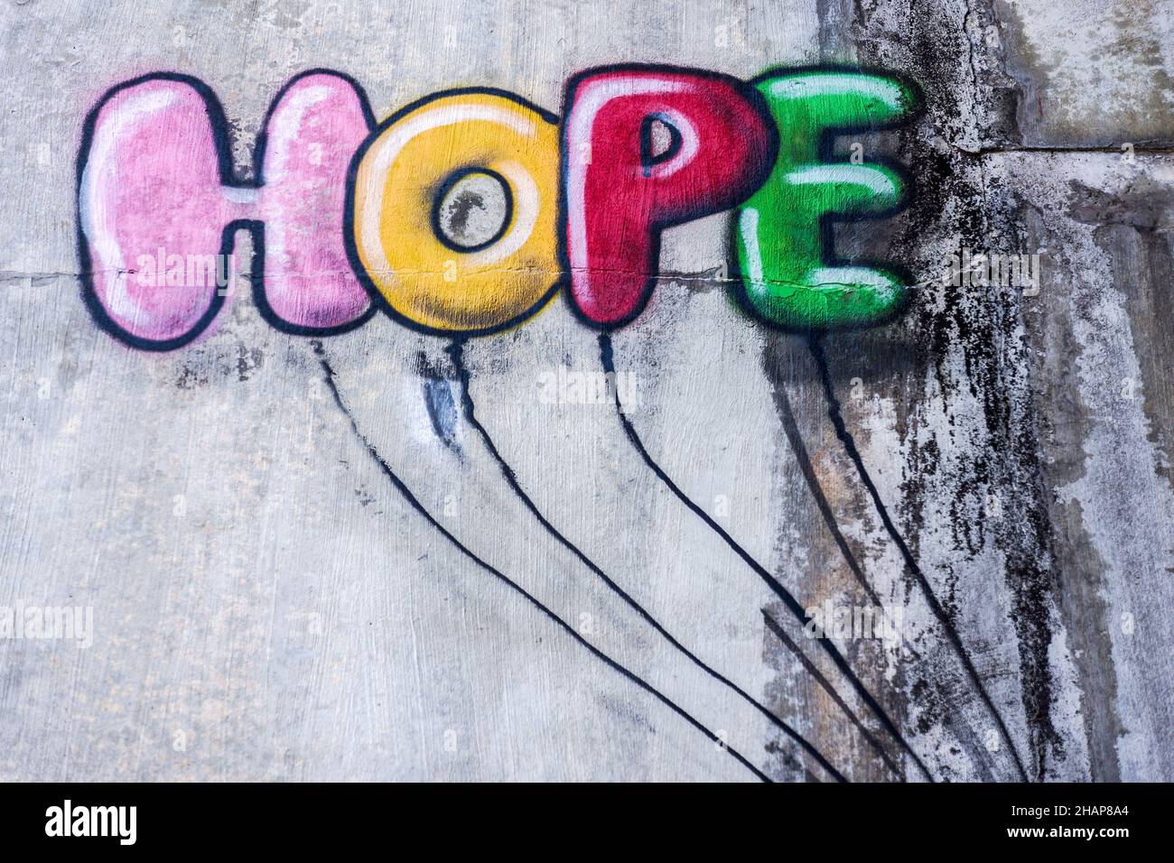 graffiti words on the wall depicting the word hope in balloon like letters. Stock Photo