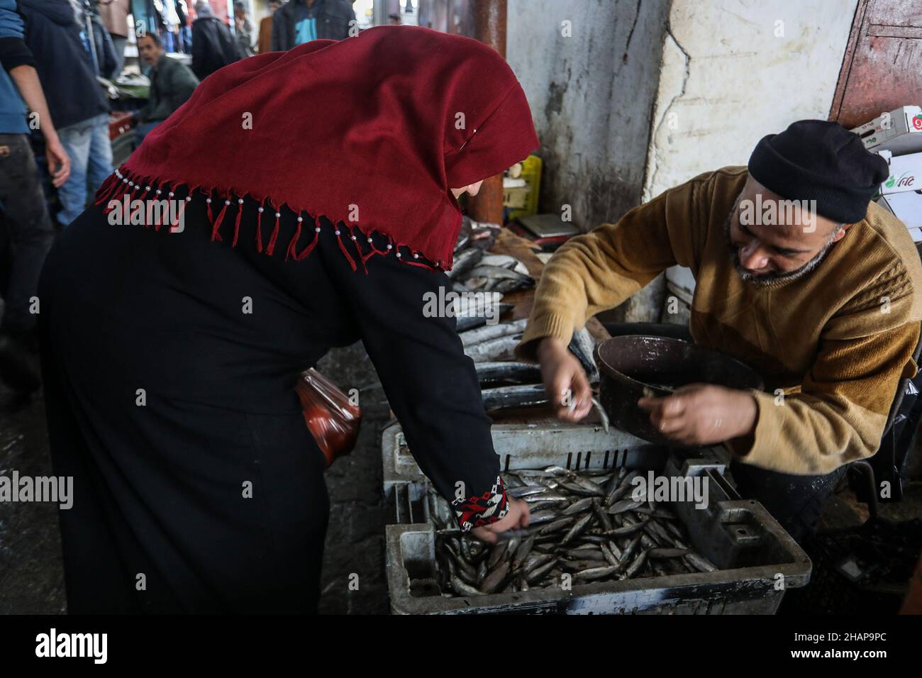 Palestinians shop in the market in Rafah, in southern Gaza Strip, on December 14, 2021. Stock Photo