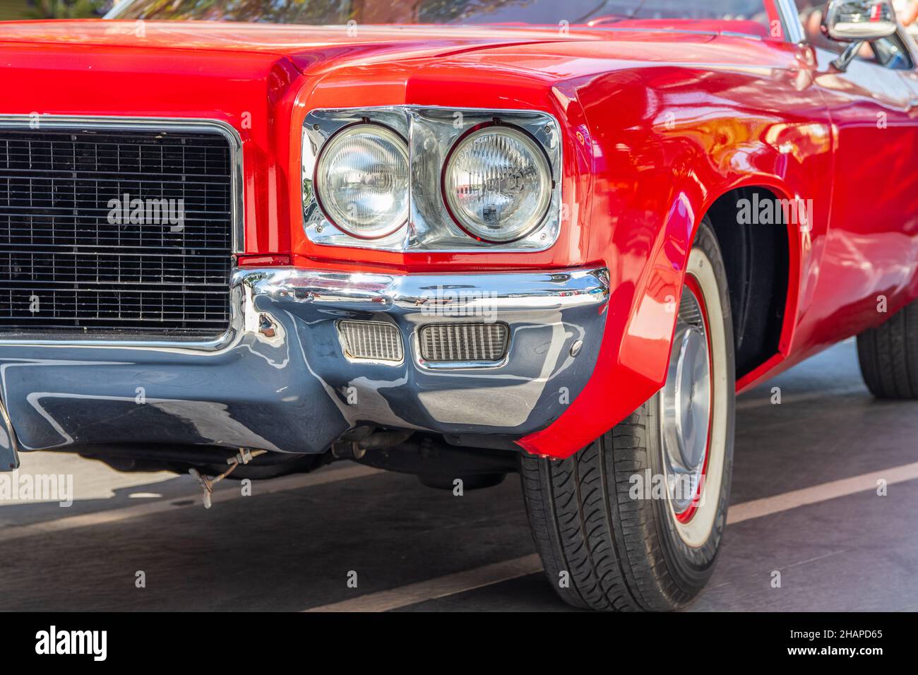 The front of a red classic car in the street Stock Photo - Alamy