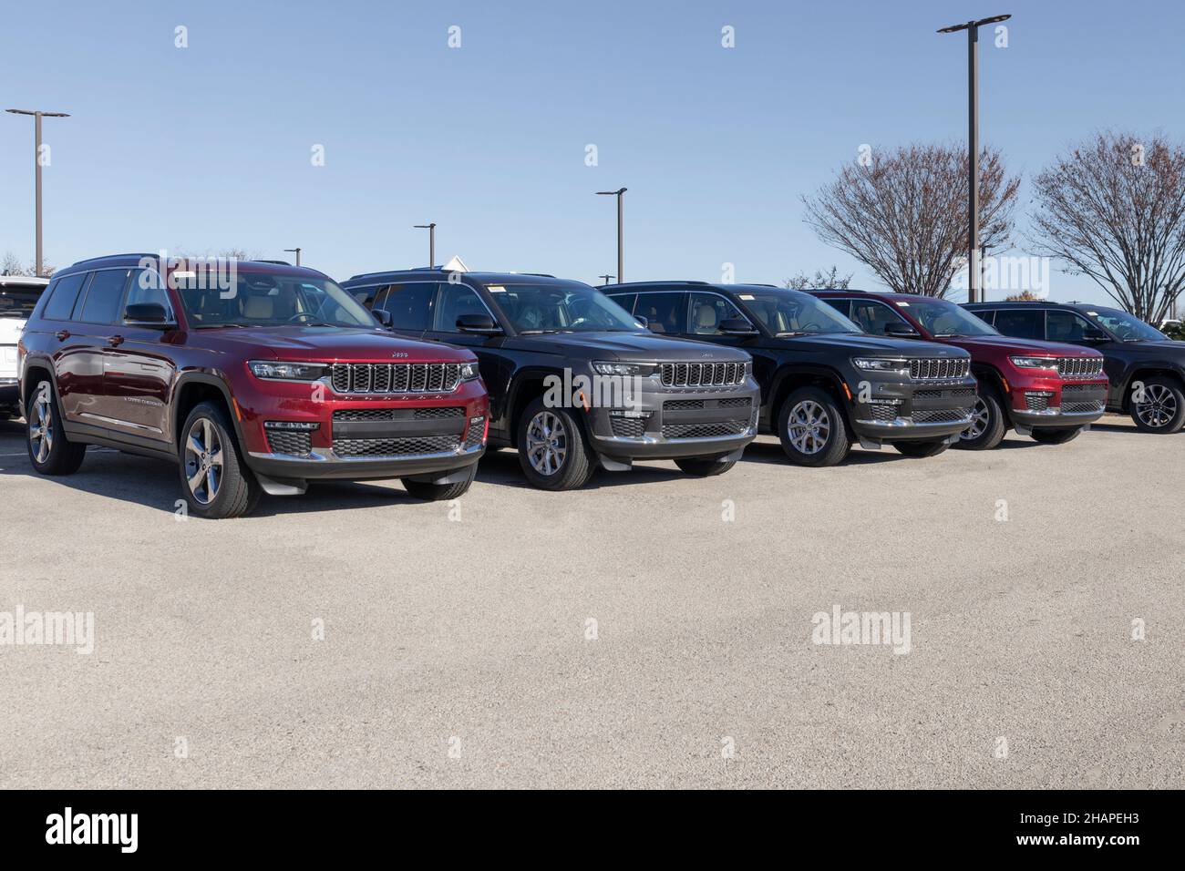 Indianapolis - Circa December 2021: Jeep Grand Cherokee SUV display at a Stellantis Jeep dealership. The Grand Cherokee models include the Laredo, Fre Stock Photo